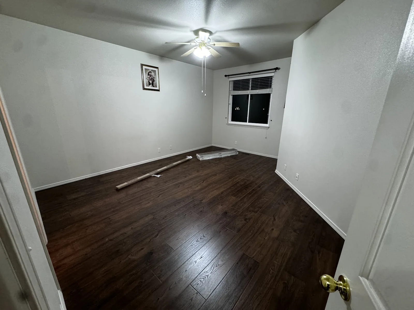 Dark wood-look laminate flooring in a bedroom