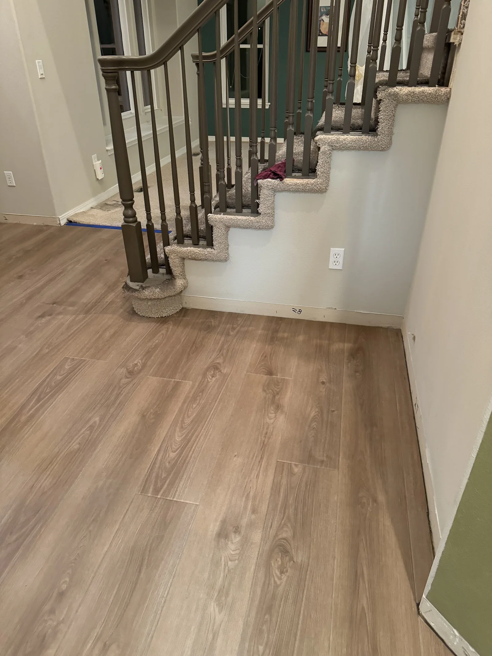 Light luxury vinyl plank flooring in a finished entryway